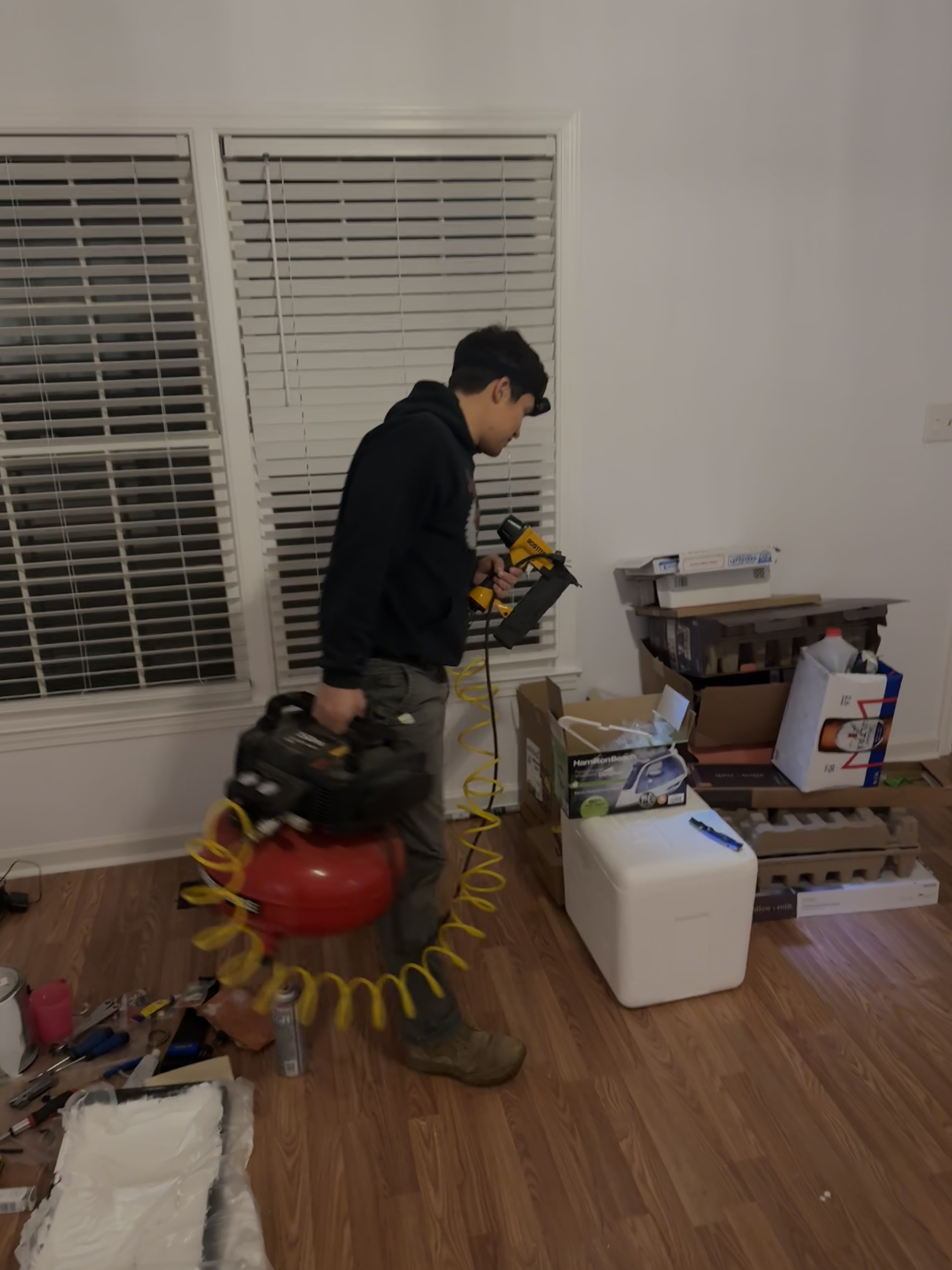 Professional painter working on interior wall